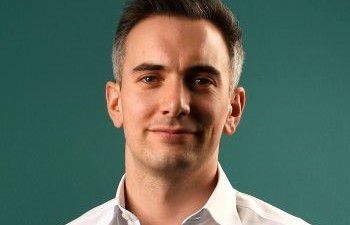 Luke Tryl smiling at the camera