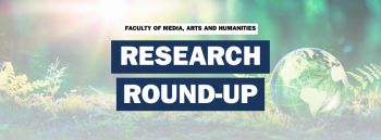 A sunlit forest with a green globe with the words Research Round-up written on the top