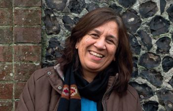 Professor Maya Unnithan smiling at the camera