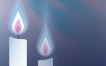 Two pink and blue candles on a blue background