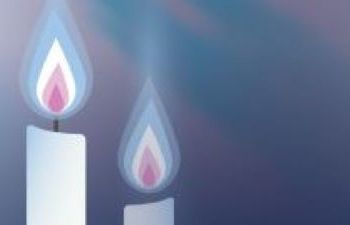 Two pink and blue candles on a blue background