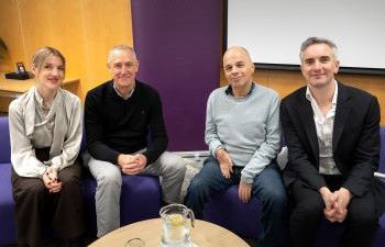 Dr Hannah Richter, Professor Paul Taggart, Professor David Ruebain and Luke Tryl smiling at the camera
