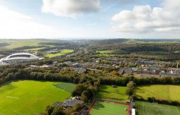 Falmer campus from the air with Falmer stadium on the left hand side