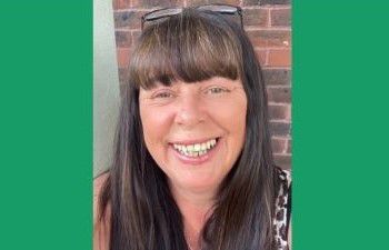 Diane Pickett smiling at the camera