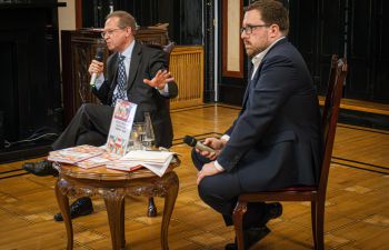 Aleks Szczerbiak (left) and Jakub Krupa (right) are shown mid-conversation at the launch of Alek's new book at the Polish Embassy in London.
