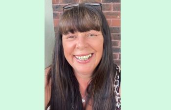 Diane Pickett smiling at the camera