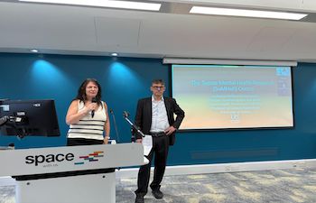 Showing the director of the centre introducing a speaker