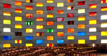 Squares of stained glass as seen from inside the Meeting House