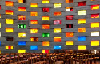 Squares of stained glass as seen from inside the Meeting House