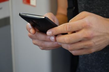 Close up of someone's hands holding a smartphone