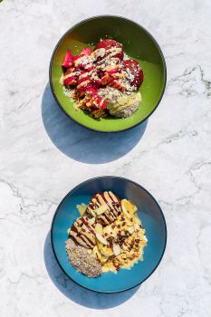 A photo of two Purple Berry breakfast bowls