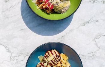 A photo of two Purple Berry breakfast bowls