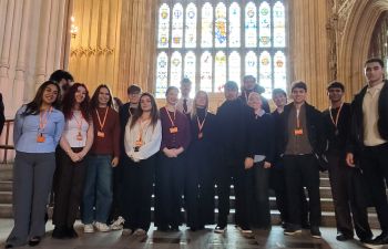 Business and Management students from the University of Sussex stand together at the Houses of Parliament after presenting sustainability projects.