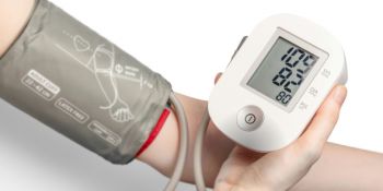 A photo of an arm showing someone receiving their blood pressure reading