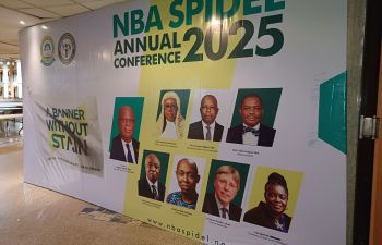 A large conference promo banner shows headshots of the key speakers, including Professor Stephen Shute