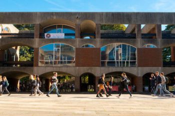 Students walking through Falmer quad