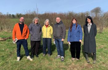 Team smiling at the Forest Food Garden