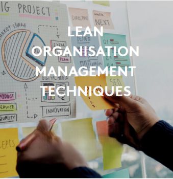 Image of a white board showing business processes in a chart and with sticky notes