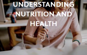 Head and shoulder picture of a person with a health drink and plate of food