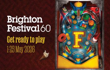 Brighton Festival 60 promotional graphic on a red textured background, with the headline “Get ready to play” and dates “1–25 May 2026” next to a colourful pinball machine featuring a large “F” at the centre.