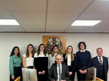 Sussex Family Law Clinic students and staff in court with President of the Family Division, Sir Andrew McFarlane, and HHJ Bedford