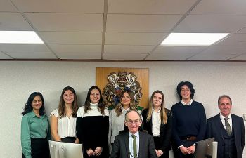 Sussex Family Law Clinic students and staff in court with President of the Family Division, Sir Andrew McFarlane, and HHJ Bedford
