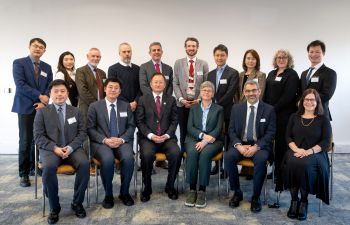 group of academics stood for group photo
