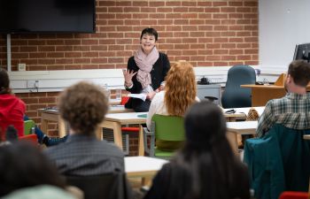 Speaker addressing participants at a workshop.