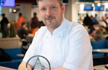 A photo of Michael King, Executive Chef at the University of Sussex, with his award for Chef of the Year