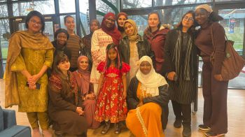 Members of the Islamic society smile for a photo in Eat Central