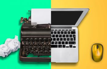 Old typewriter and new laptop side by side