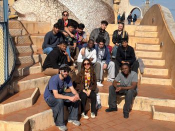 Students sat in the sunshine on the roof of Casa Mila, an iconic apartment block in Barcelona