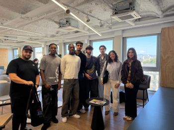 students standing in the lobby of Toulous Business School