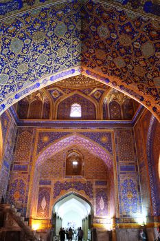 This photograph shows the beautiful and ornate wall decoration inside an Uzbekistan place of worship.