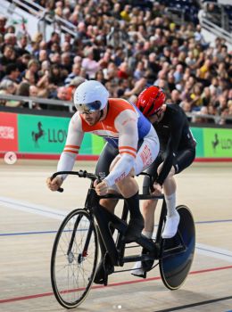 Freddy (wearing a red helmet) and his tandem partner Aaron Pope competing at British Cycling’s 2026 Lloyds National Track Championship in Manchester in February