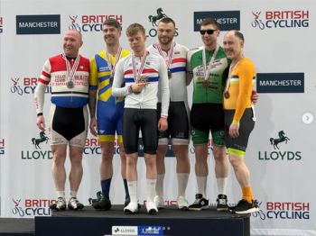 Gold medal winners: Freddy on the medal podium (third from left) with his tandem partner Aaron Pope (fourth from left)