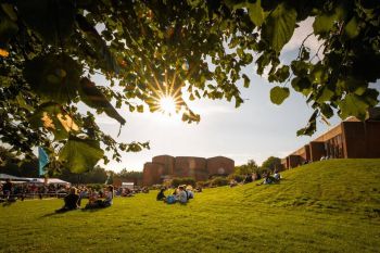 Sussex University campus, sunlight and students having a nice time