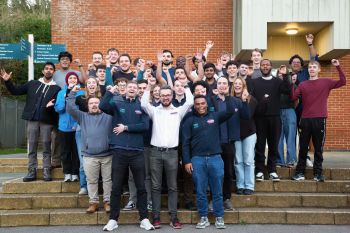 The team from Sussex Racing all standing and waving for the camera.