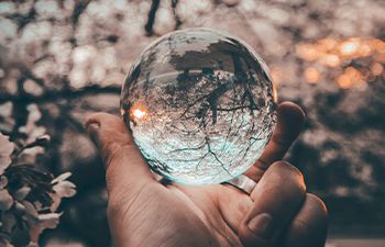 Large glass ball held in a hand