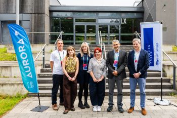 Right to Left - Cornell Sanvoss Robin Banerjee, Annie McEntee, Louise Turton, Elena Southard, Matt Montgomery, stood in front of university steps