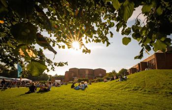 Sussex University campus, sunlight and students having a nice time