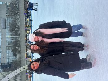 Kristabel at an ice skating rink in Canada with two friends