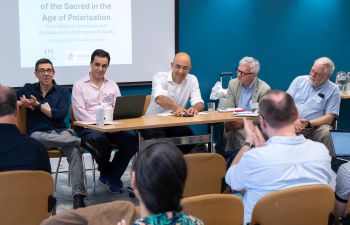 Conference panel with scholars from around the world