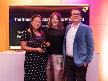 A photo showing two members of the Careers and Entrepreneurship team with a representative for the Graduate Futures Institute, receiving the overall institutional prize