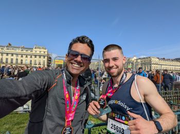 Two runners smiling at camera after finishing the Brighton marathon