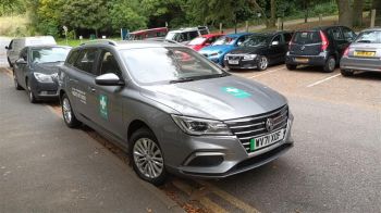 A picture of a grey estate car with first aid logos on it.