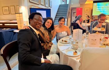 Mentee Tony (left) with his mentor Nazy sat next to him at the Helena Normanton Legacy Afternoon tea. Next to them both sits Chevening Scholar Hasti.