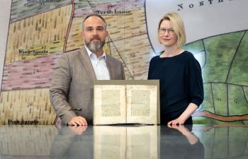 Dr Katie Walter and Dr James Wade in The Keep archive, Brighton, with the fragment of Nicholas Love’s early 15th-century Mirror of the Blessed Life of Jesus Christ