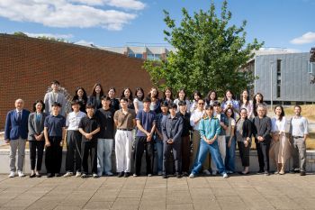 SNU university students and faculty from Korea pose with SPRU faculty outside University of Sussex Business School