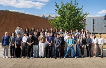SNU university students and faculty from Korea pose with SPRU faculty outside University of Sussex Business School